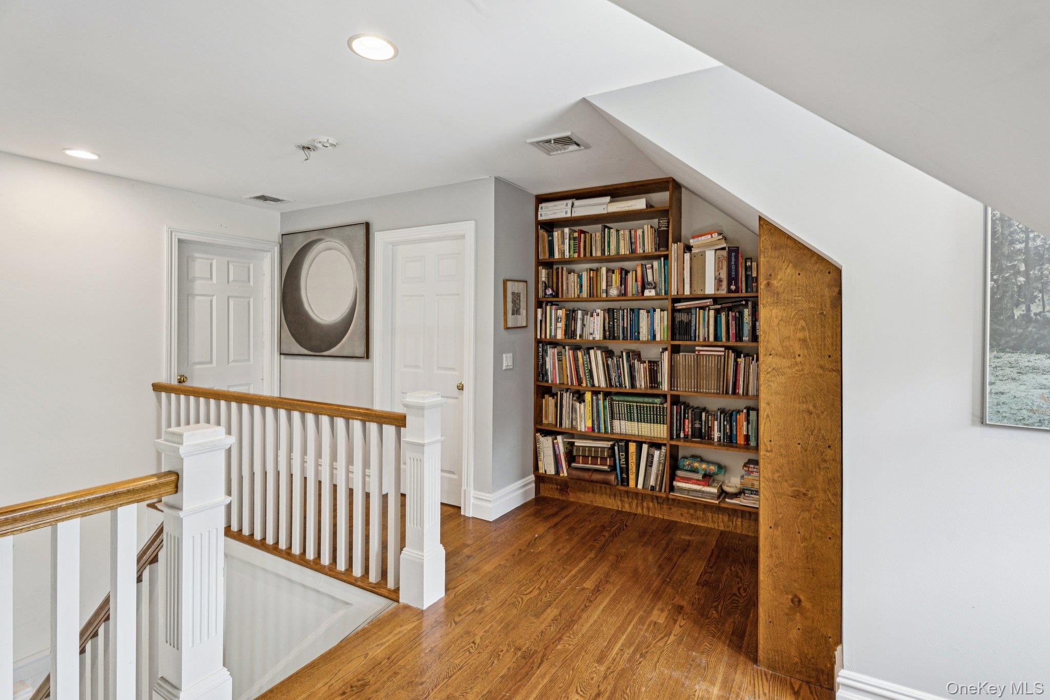 12 Laila Lane Remsenburg, NY 11960 - Photo 26 of 50 a view of a hallway with wooden floor and staircase