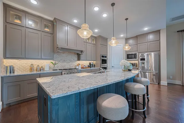 a living room with furniture and wooden floors