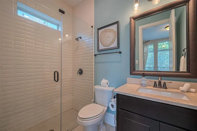 a bathroom with double sink and a mirror