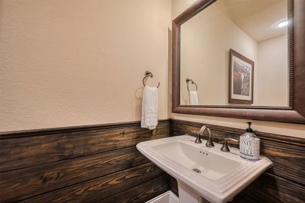 a spacious bedroom with a bed and a window