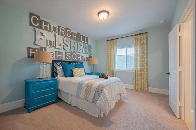 a bathroom with a granite countertop toilet sink and mirror
