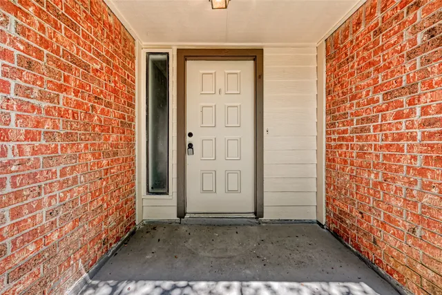 a view of a brick house with an outdoor space