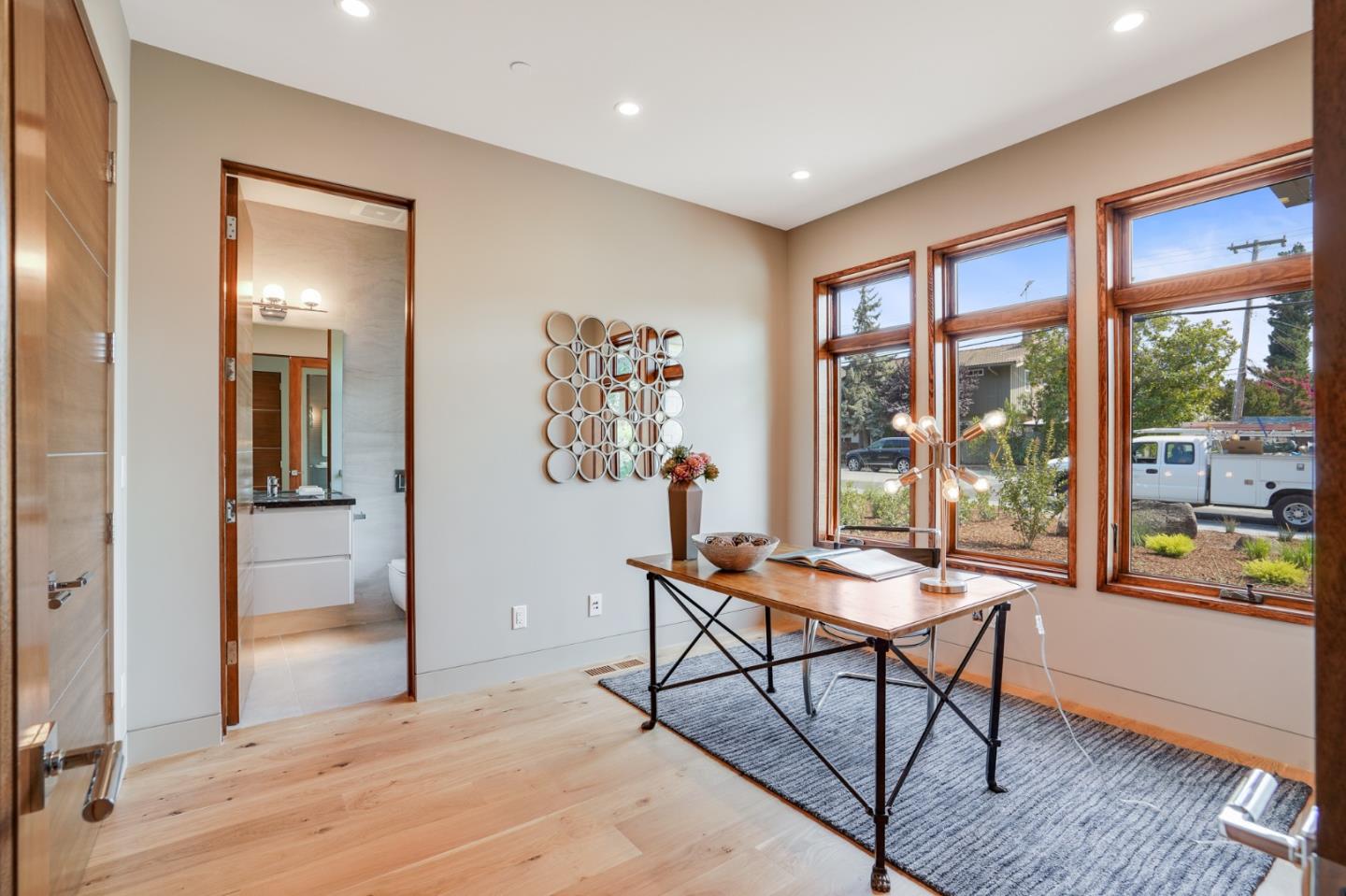 67 Lyell Street Los Altos, CA 94022 - Photo 19 of 31 a workspace with wooden floor and a window
