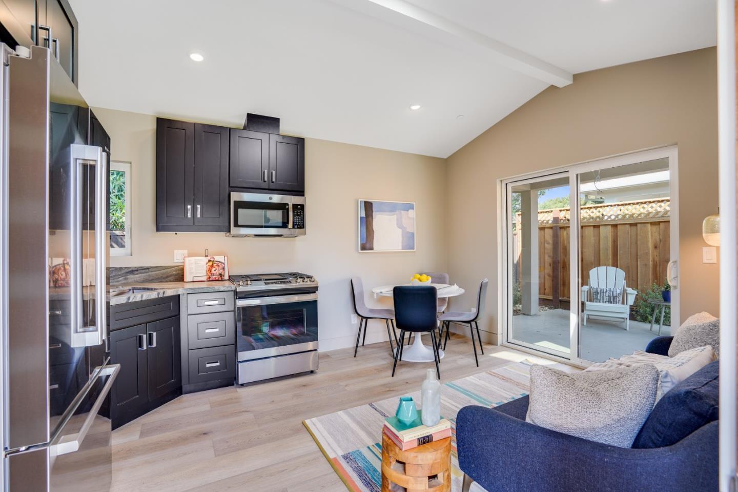 67 Lyell Street Los Altos, CA 94022 - Photo 23 of 31 a kitchen with stainless steel appliances granite countertop a stove and a refrigerator