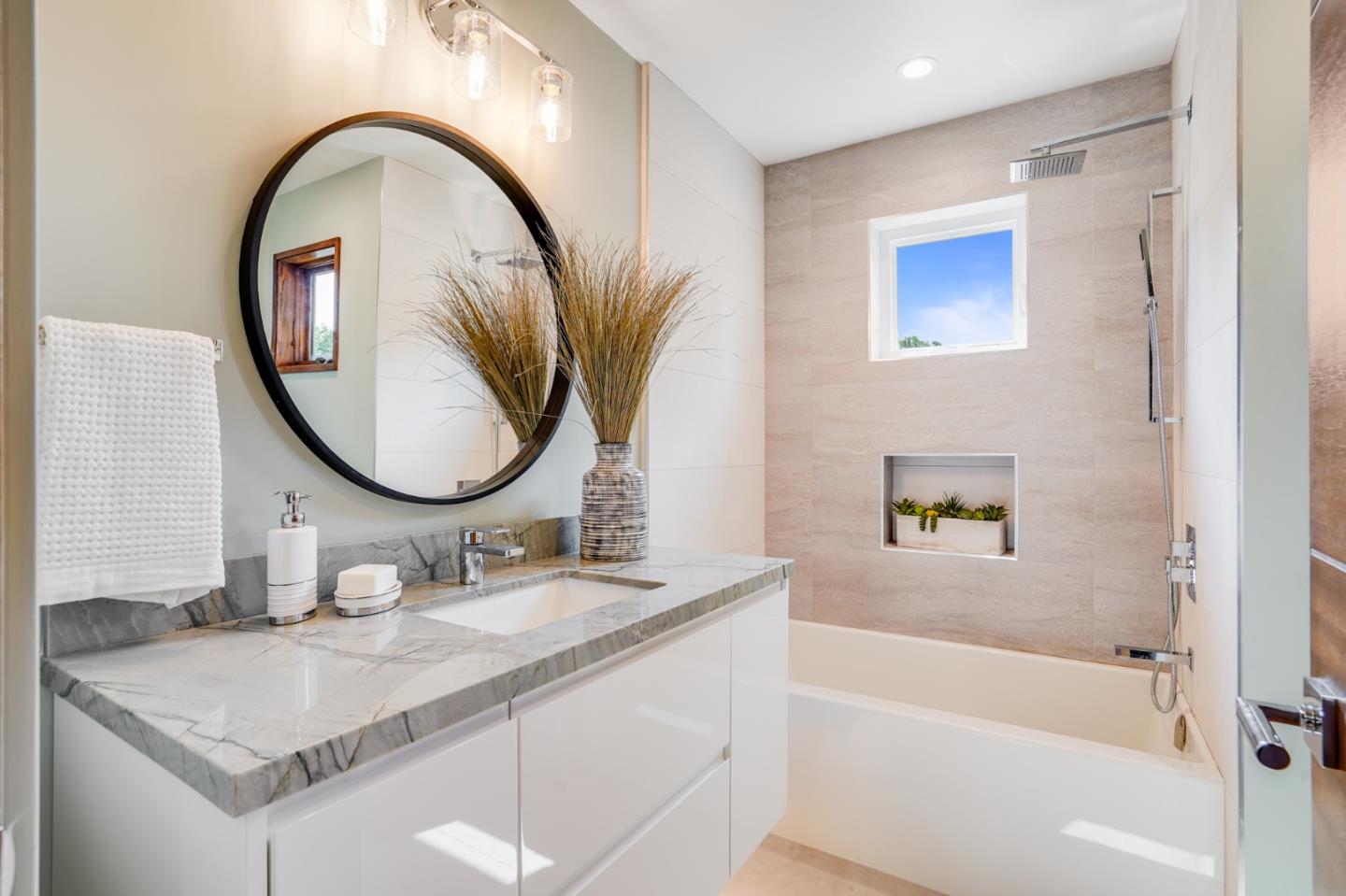 67 Lyell Street Los Altos, CA 94022 - Photo 27 of 31 a bathroom with a granite countertop sink mirror and a bathtub