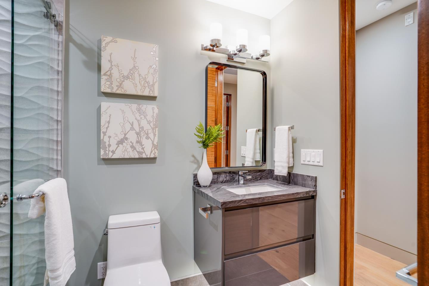 67 Lyell Street Los Altos, CA 94022 - Photo 28 of 31 a bathroom with a toilet sink and mirror