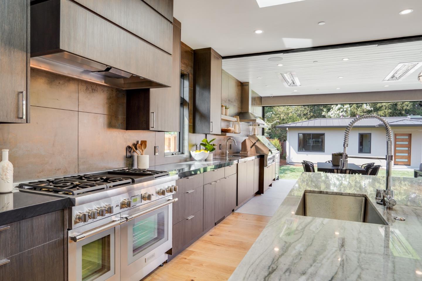 67 Lyell Street Los Altos, CA 94022 - Photo 8 of 31 a large kitchen with stainless steel appliances granite countertop a stove and a sink