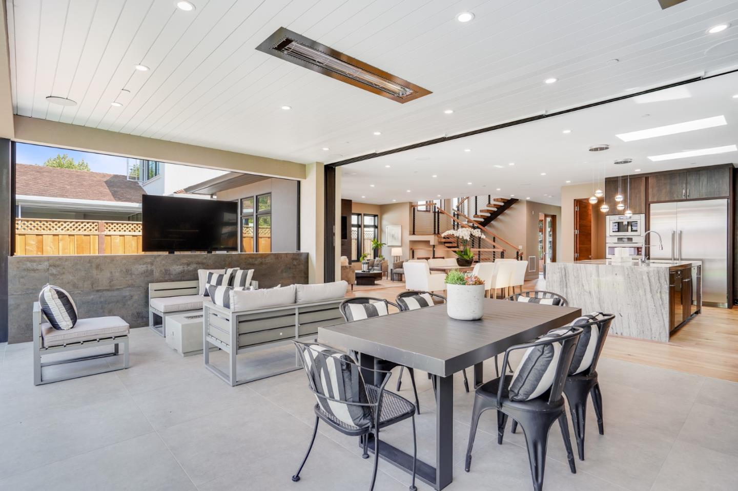 67 Lyell Street Los Altos, CA 94022 - Photo 10 of 31 a living room with furniture and a flat screen tv