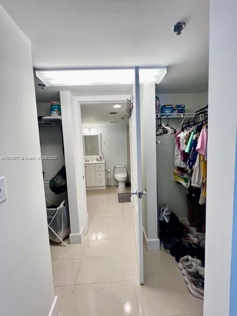 1200 Brickell Bay Drive, Unit 2008 Miami, FL 33131 - Photo 14 of 37 a view of a hallway with closet and a bathroom