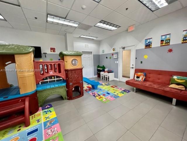 1200 Brickell Bay Drive, Unit 2008 Miami, FL 33131 - Photo 23 of 37 a play room with toys