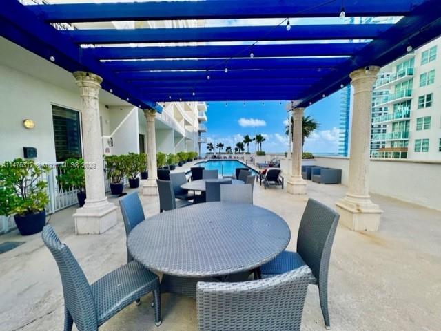 1200 Brickell Bay Drive, Unit 2008 Miami, FL 33131 - Photo 25 of 37 a view of a dining room with furniture and window