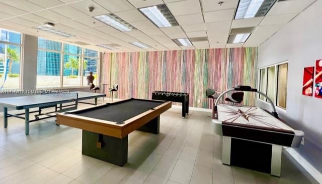 1200 Brickell Bay Drive, Unit 2008 Miami, FL 33131 - Photo 28 of 37 a living room with furniture and a window