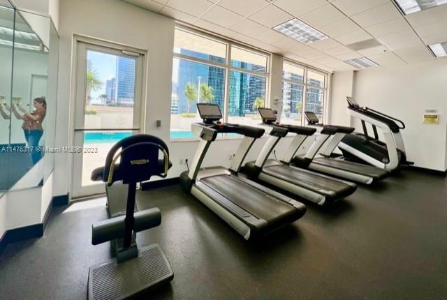 1200 Brickell Bay Drive, Unit 2008 Miami, FL 33131 - Photo 30 of 37 a view of a room with gym equipment