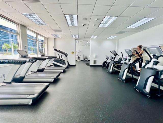 1200 Brickell Bay Drive, Unit 2008 Miami, FL 33131 - Photo 31 of 37 a view of a room with gym equipment