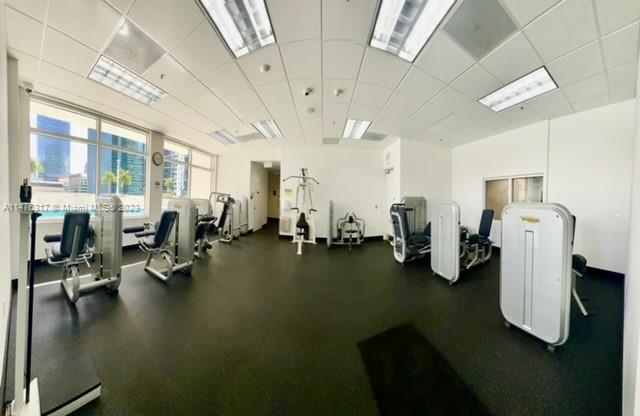 1200 Brickell Bay Drive, Unit 2008 Miami, FL 33131 - Photo 32 of 37 a view of a room with gym equipment