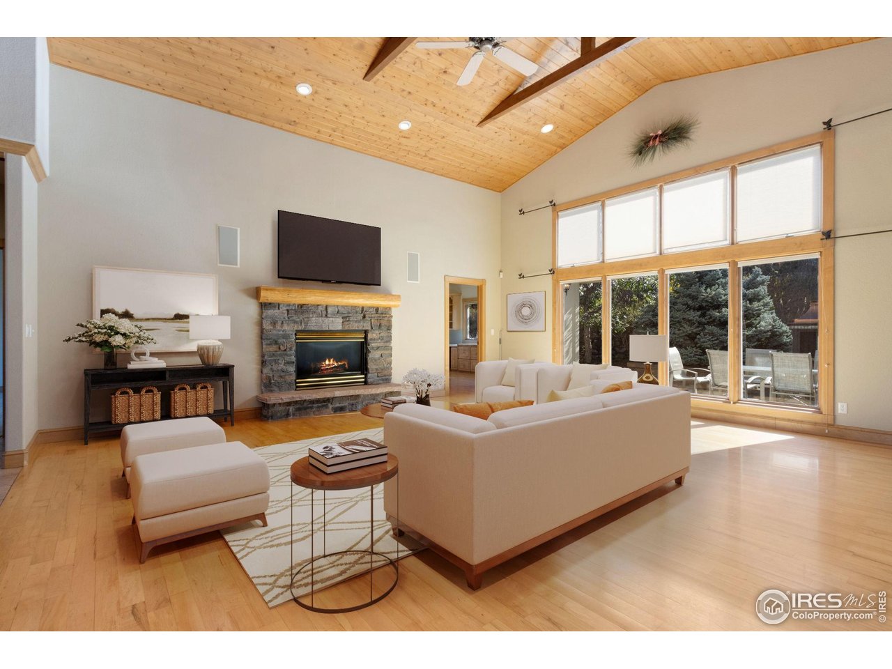Vaulted ceilings and natural light galore in this Great Room. Gas fireplace.  20x22 virtual stage