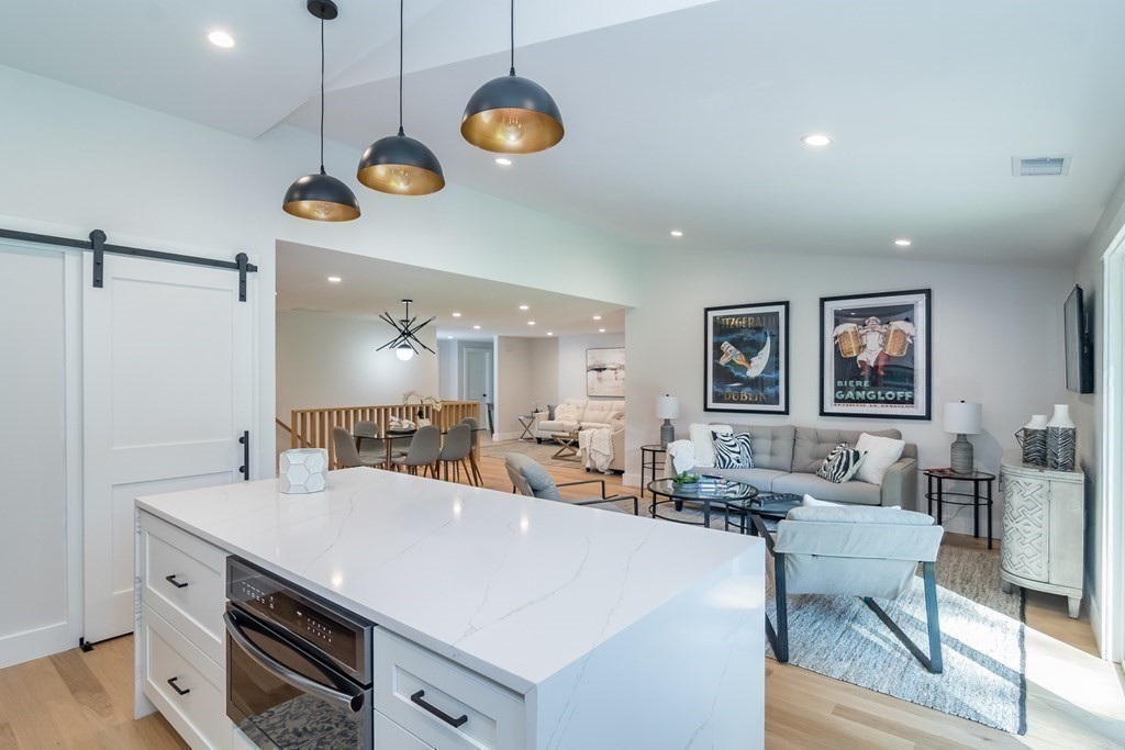 28 Perry Drive Needham, MA 02492 - Photo 11 of 35 a view of kitchen and living room with wooden floor