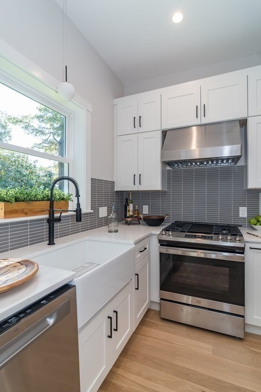 28 Perry Drive Needham, MA 02492 - Photo 12 of 35 a kitchen with a stove and a sink