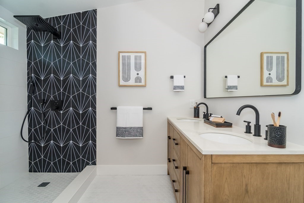 28 Perry Drive Needham, MA 02492 - Photo 18 of 35 a bathroom with a sink and a mirror