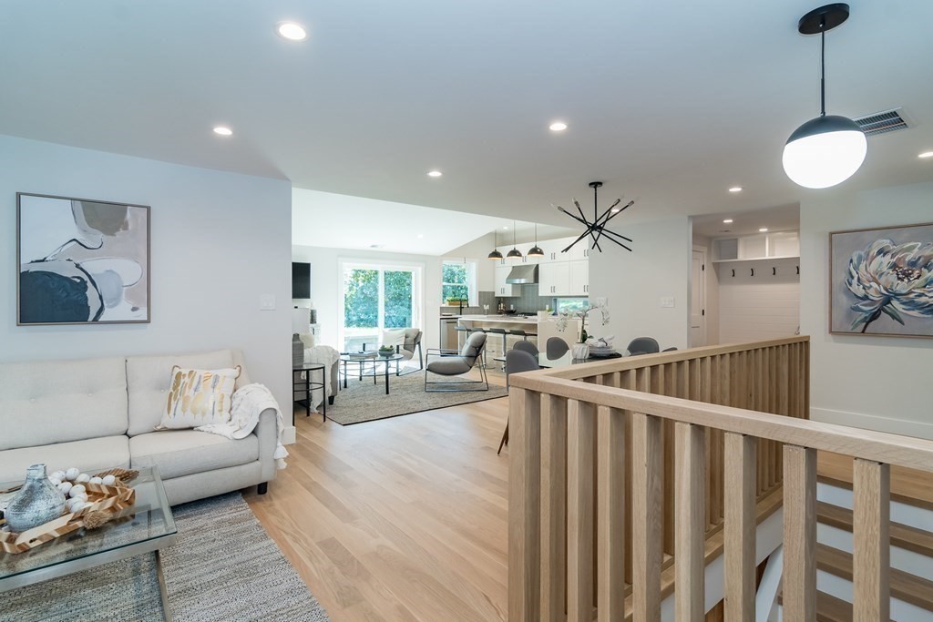 28 Perry Drive Needham, MA 02492 - Photo 2 of 35 a living room with furniture and a wooden floor
