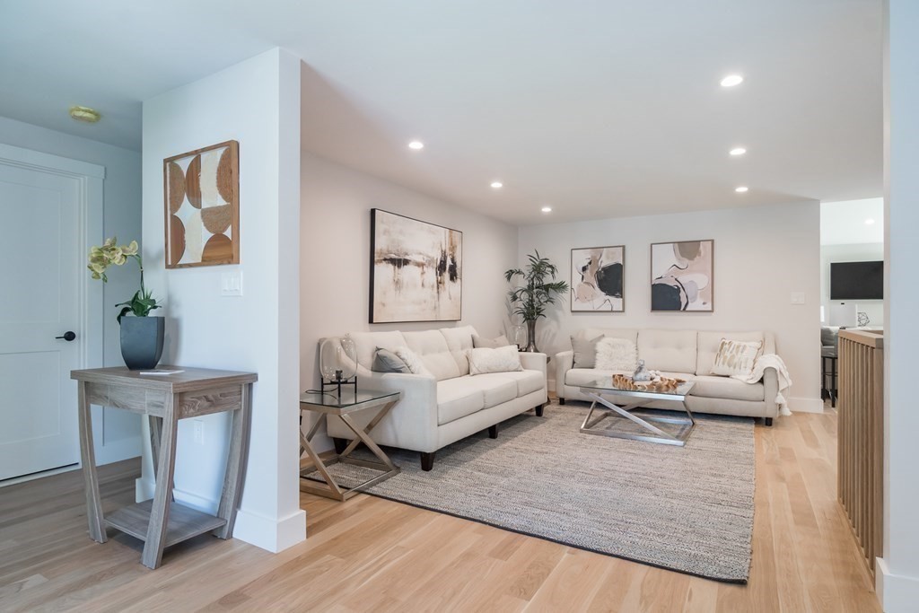 28 Perry Drive Needham, MA 02492 - Photo 3 of 35 a living room with furniture and wooden floor