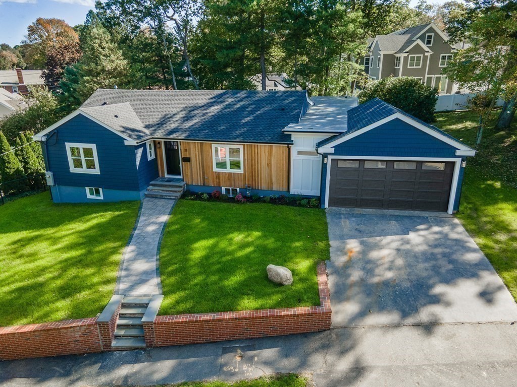 28 Perry Drive Needham, MA 02492 - Photo 31 of 35 a front view of a house with garden