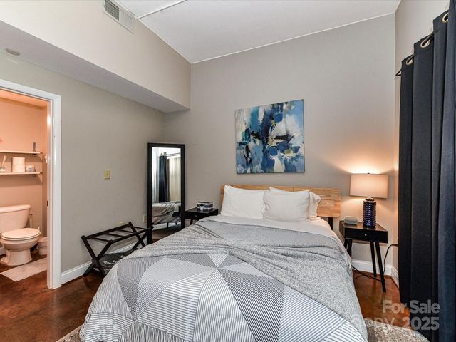 a bedroom with a bed and a cabinets