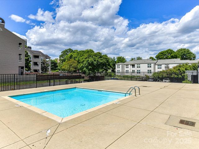 a view of a chairs and table in patio