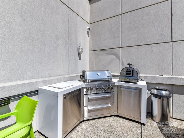 a view of a dining room with furniture and a chandelier