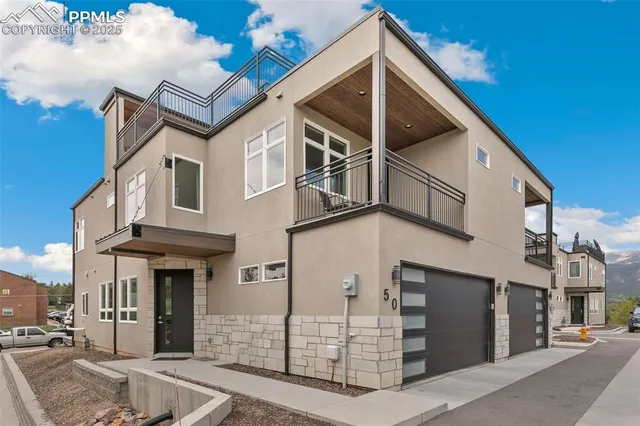 a view of a white building with a large windows
