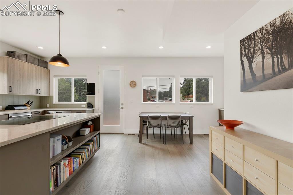 50 Sommerlyn Road Colorado Springs, CO 80906 - Photo 11 of 39 a kitchen with stainless steel appliances granite countertop a stove and a wooden floors