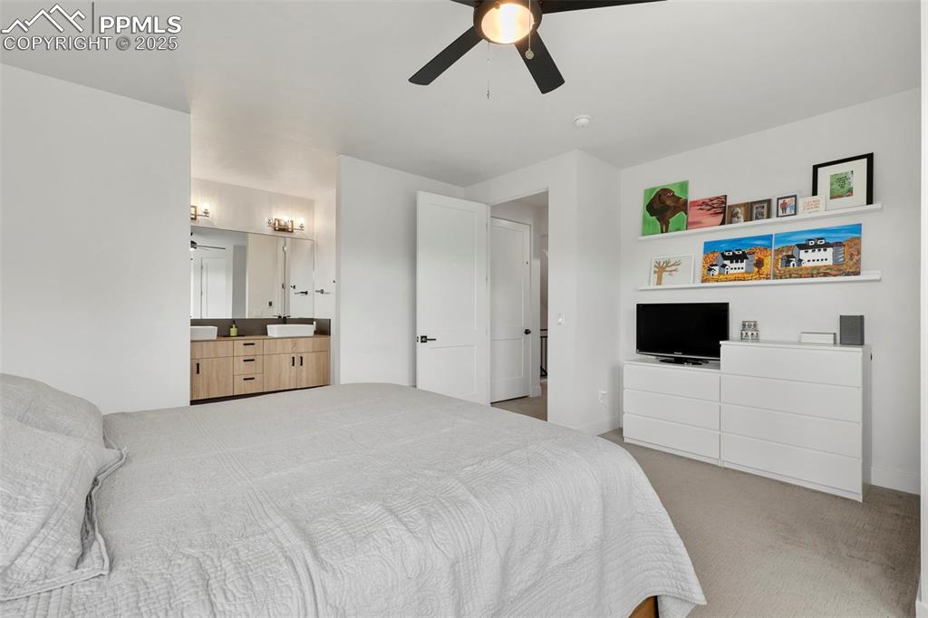 50 Sommerlyn Road Colorado Springs, CO 80906 - Photo 19 of 39 a bedroom with a bed and cabinets