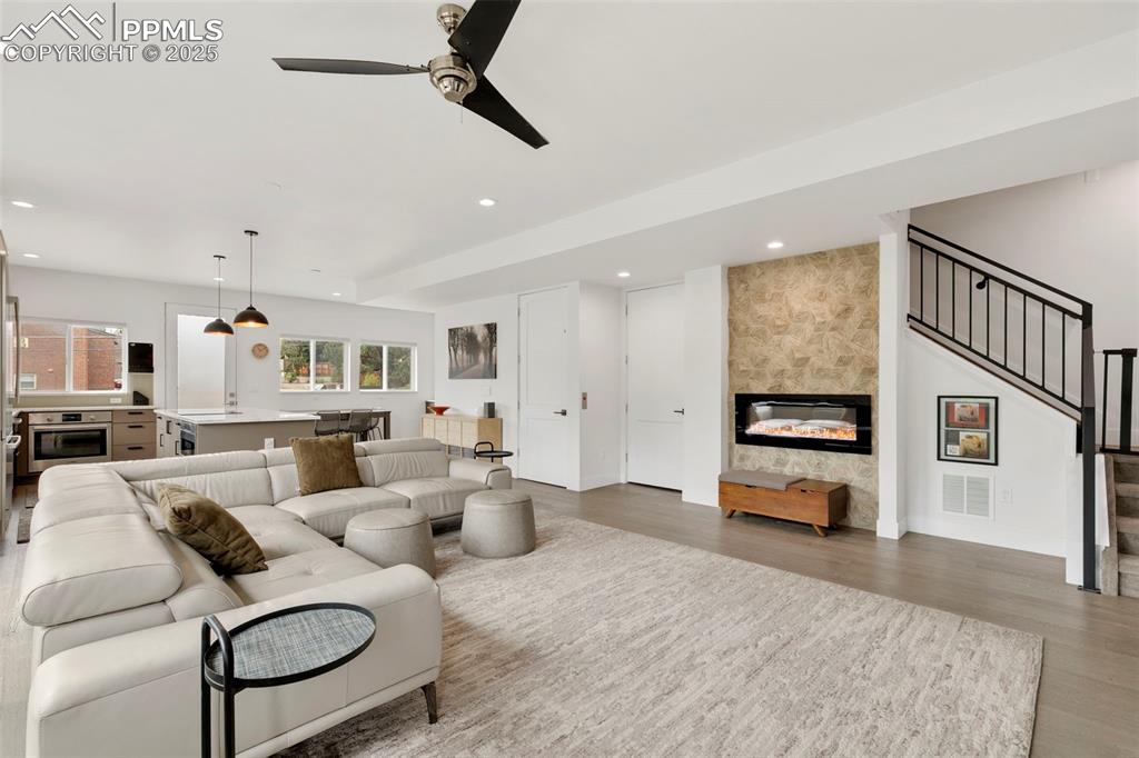 50 Sommerlyn Road Colorado Springs, CO 80906 - Photo 2 of 39 a living room with furniture and a flat screen tv