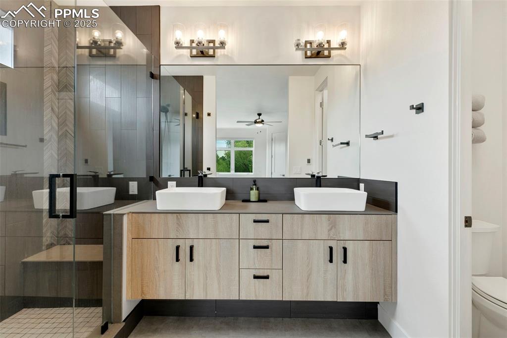 50 Sommerlyn Road Colorado Springs, CO 80906 - Photo 21 of 39 a bathroom with double sink and two mirror