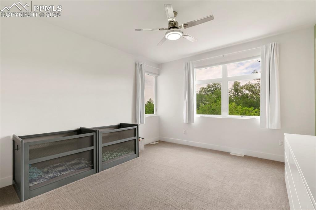 50 Sommerlyn Road Colorado Springs, CO 80906 - Photo 23 of 39 a view of room with window and a ceiling fan