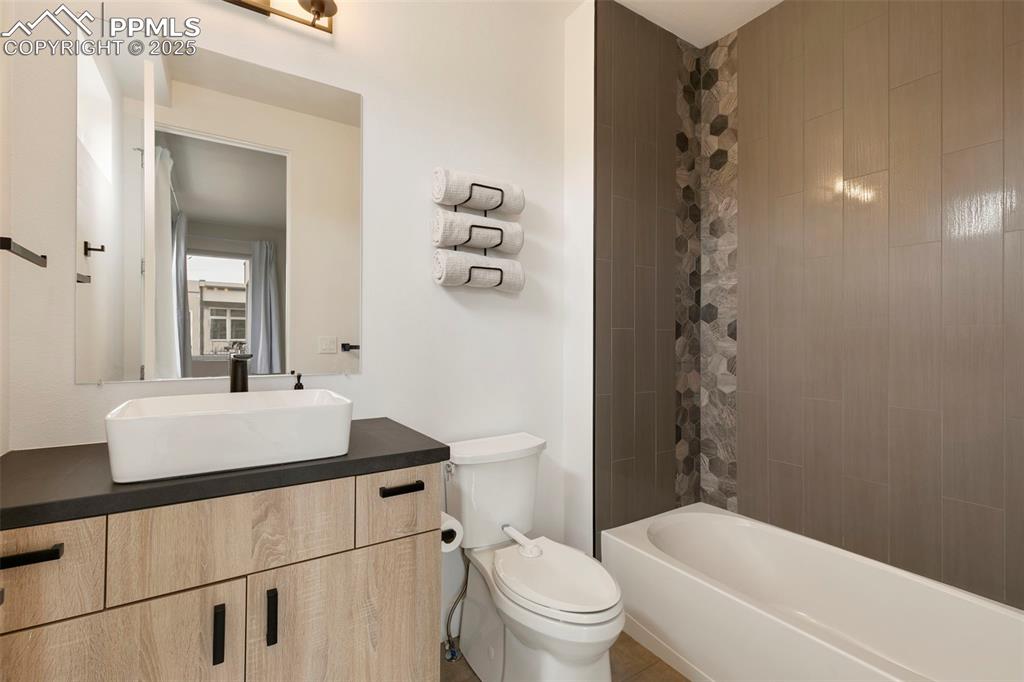 50 Sommerlyn Road Colorado Springs, CO 80906 - Photo 25 of 39 a bathroom with a sink toilet and shower