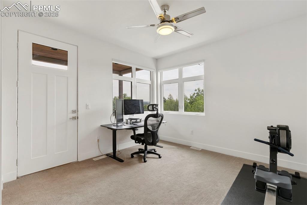 50 Sommerlyn Road Colorado Springs, CO 80906 - Photo 26 of 39 a view of a workspace with furniture and a window
