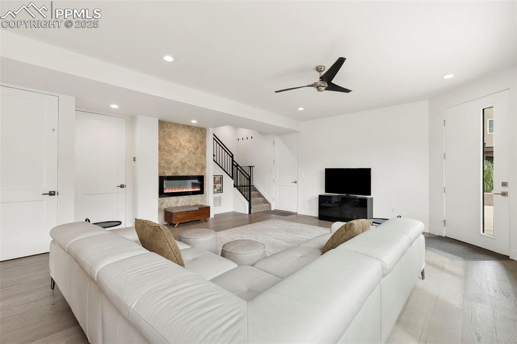 50 Sommerlyn Road Colorado Springs, CO 80906 - Photo 7 of 39 a bedroom with furniture and a flat screen tv