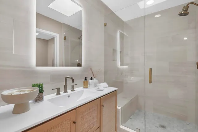 a bathroom with a sink and a mirror