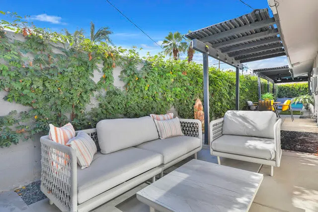 a outdoor living space with furniture and city view