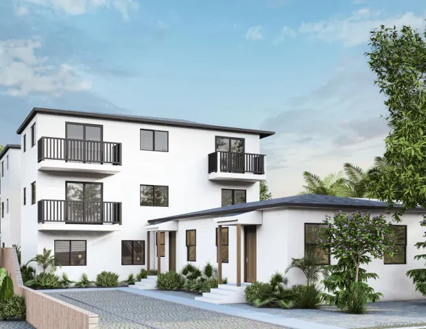 a front view of a house with plants