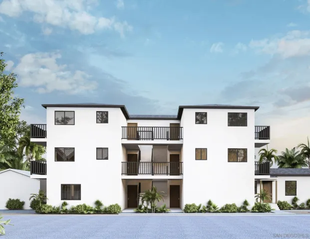 a view of residential with large building and wooden fence