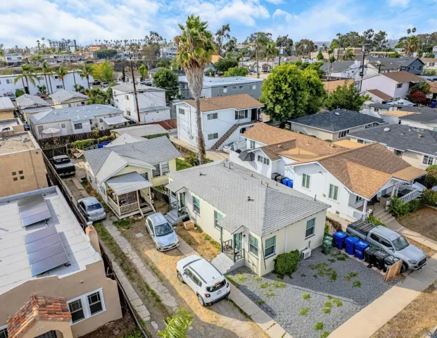 an aerial view of residential houses with outdoor space