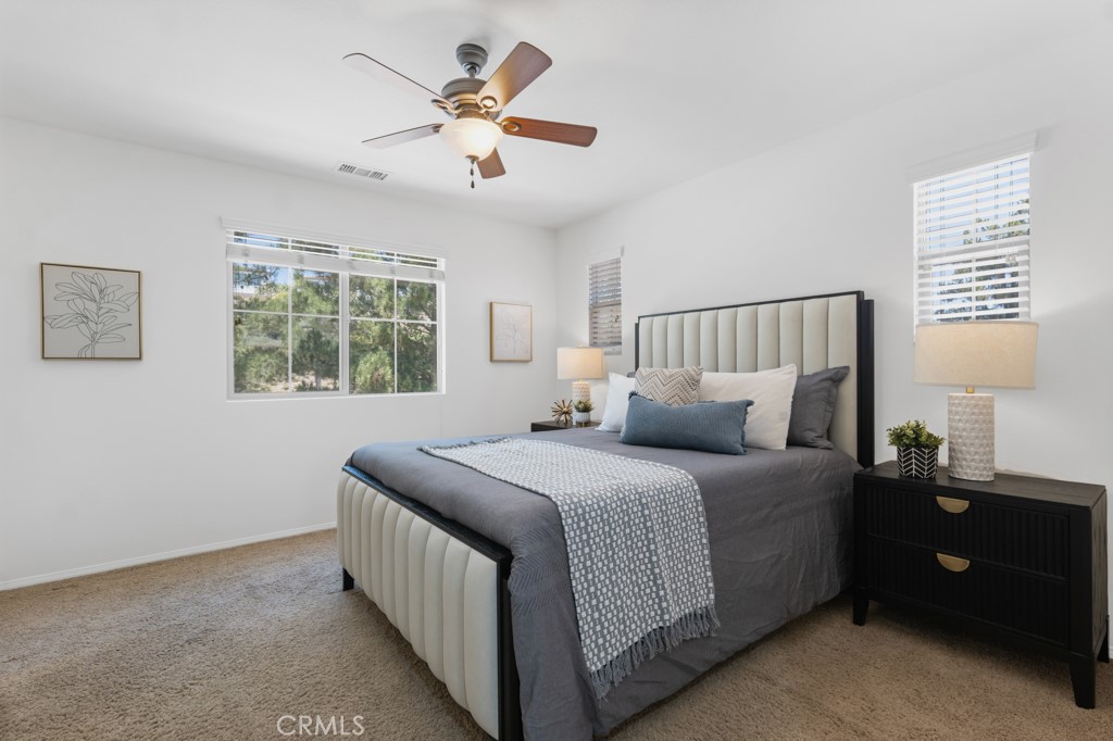 20317 Livorno Porter Ranch Porter Ranch, CA 91326 - Photo 16 of 33 a bedroom with a bed and a window