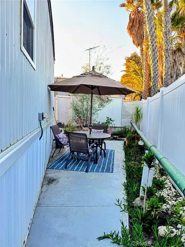 a view of swimming pool with a table and chairs