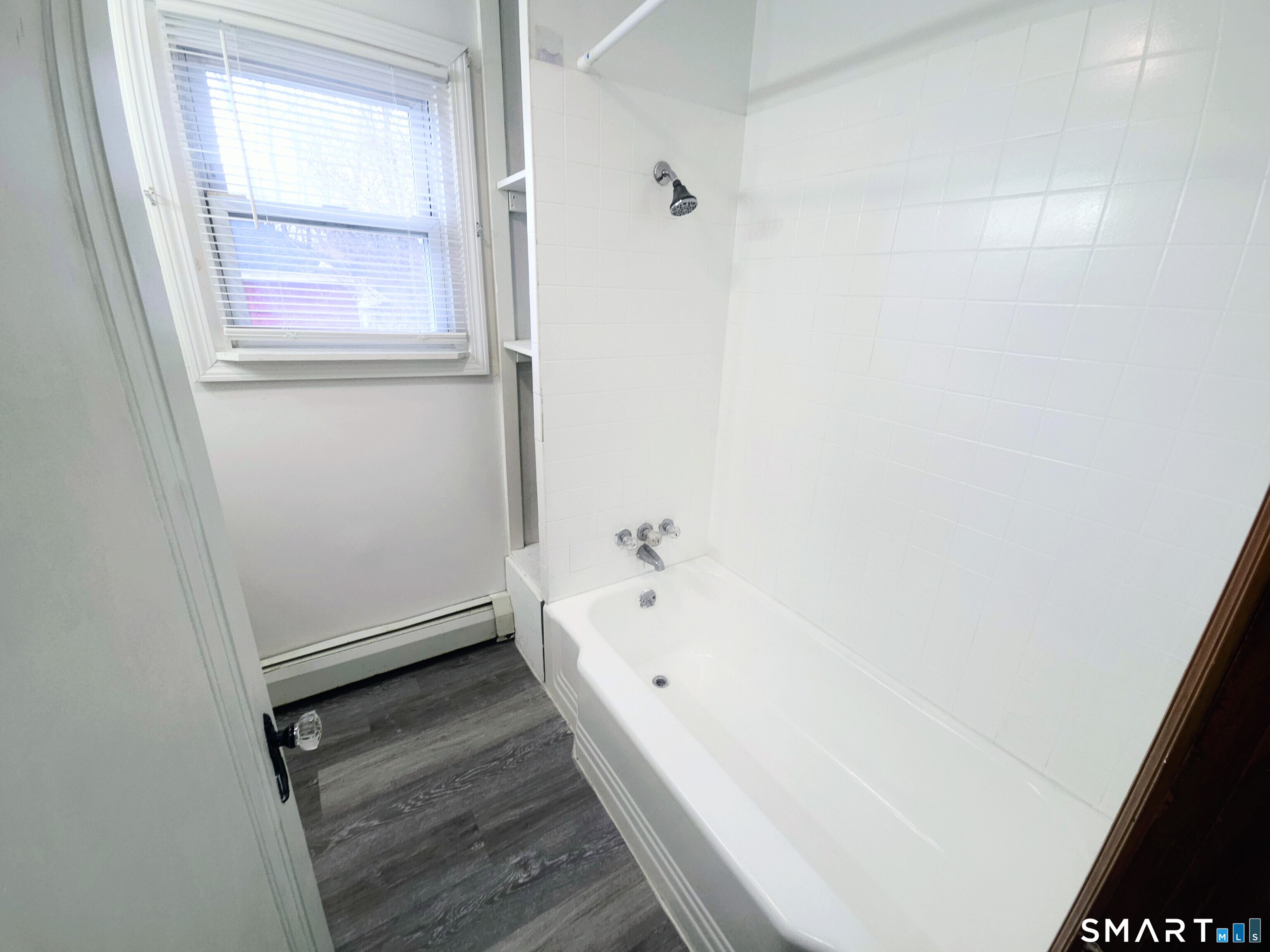 387 Putnam Pike Killingly, CT 06241 - Photo 12 of 17 a bathroom with a bathtub and a shower