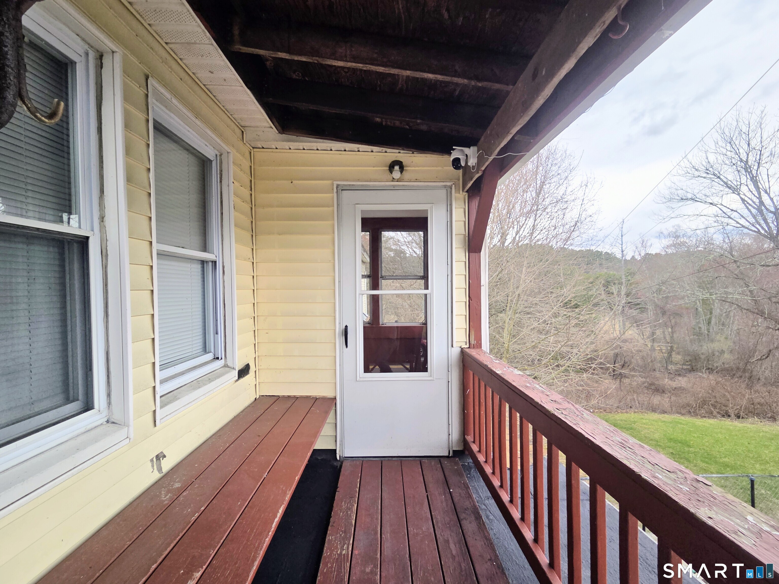 387 Putnam Pike Killingly, CT 06241 - Photo 3 of 17 a view of a balcony with wooden floor
