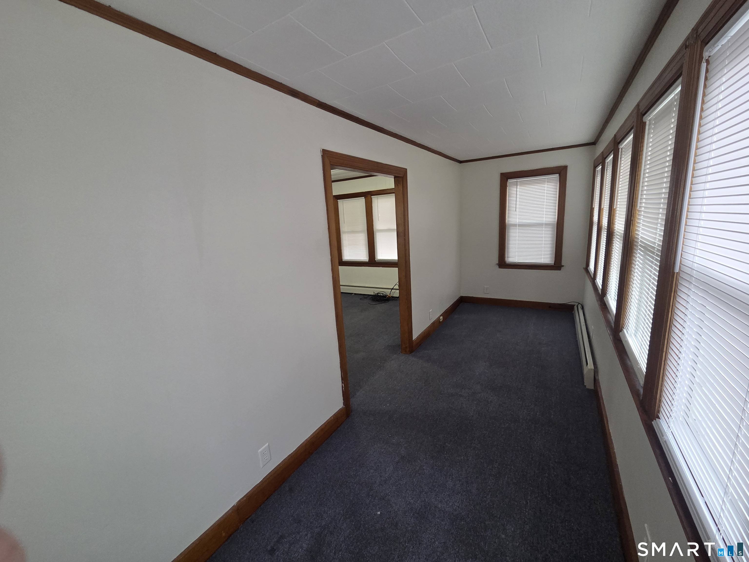387 Putnam Pike Killingly, CT 06241 - Photo 5 of 17 an empty room with windows