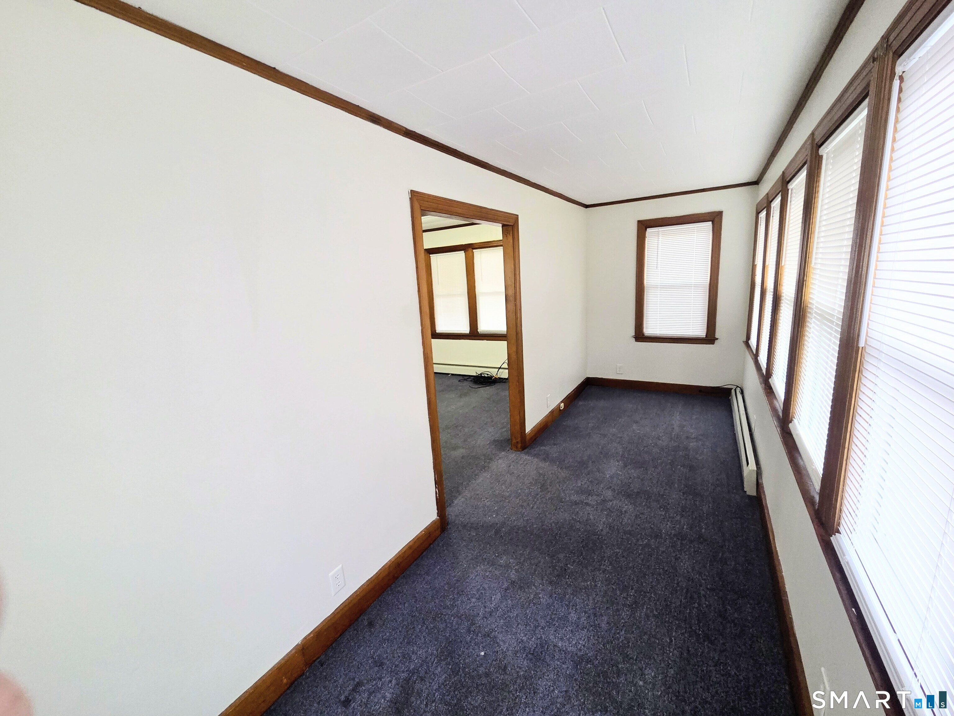 387 Putnam Pike Killingly, CT 06241 - Photo 6 of 17 an empty room with windows