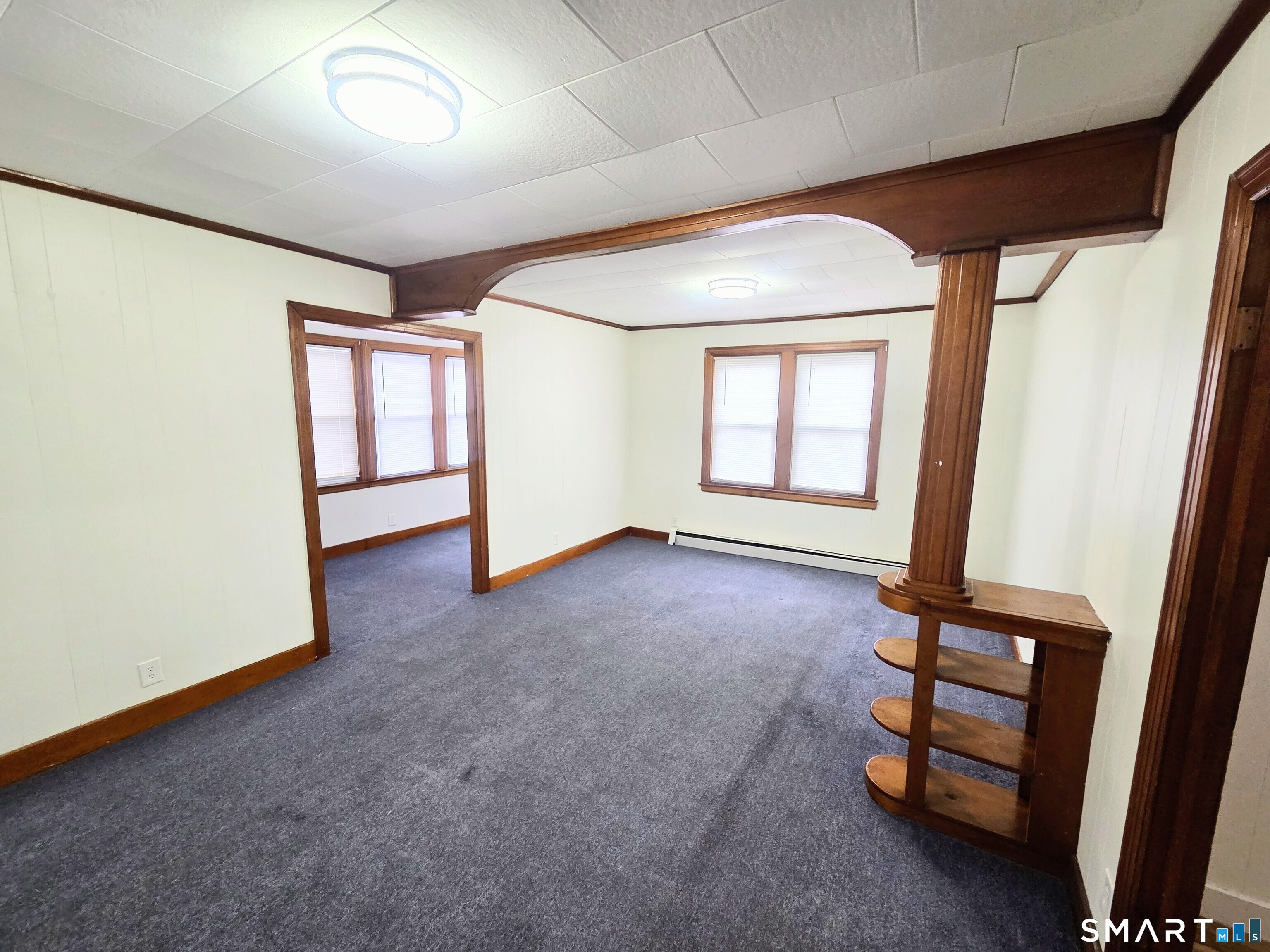 387 Putnam Pike Killingly, CT 06241 - Photo 8 of 17 an empty room with windows and closet